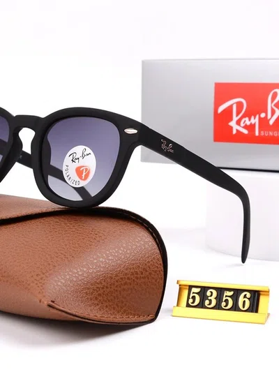 black acetate sunglasses beside a brown leather case and a yellow tag