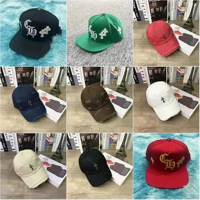 nine embroidered caps in team colours photographed on a wooden table