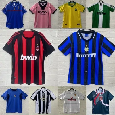 retro football shirts pinned on a white brick wall, striped and plain fronts