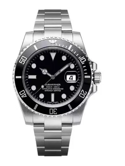 steel dive watch with black dial and bezel stood upright on a bracelet