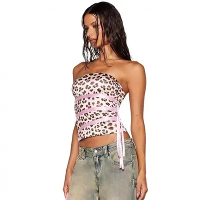 model in a leopard-print tube top and low-rise washed jeans